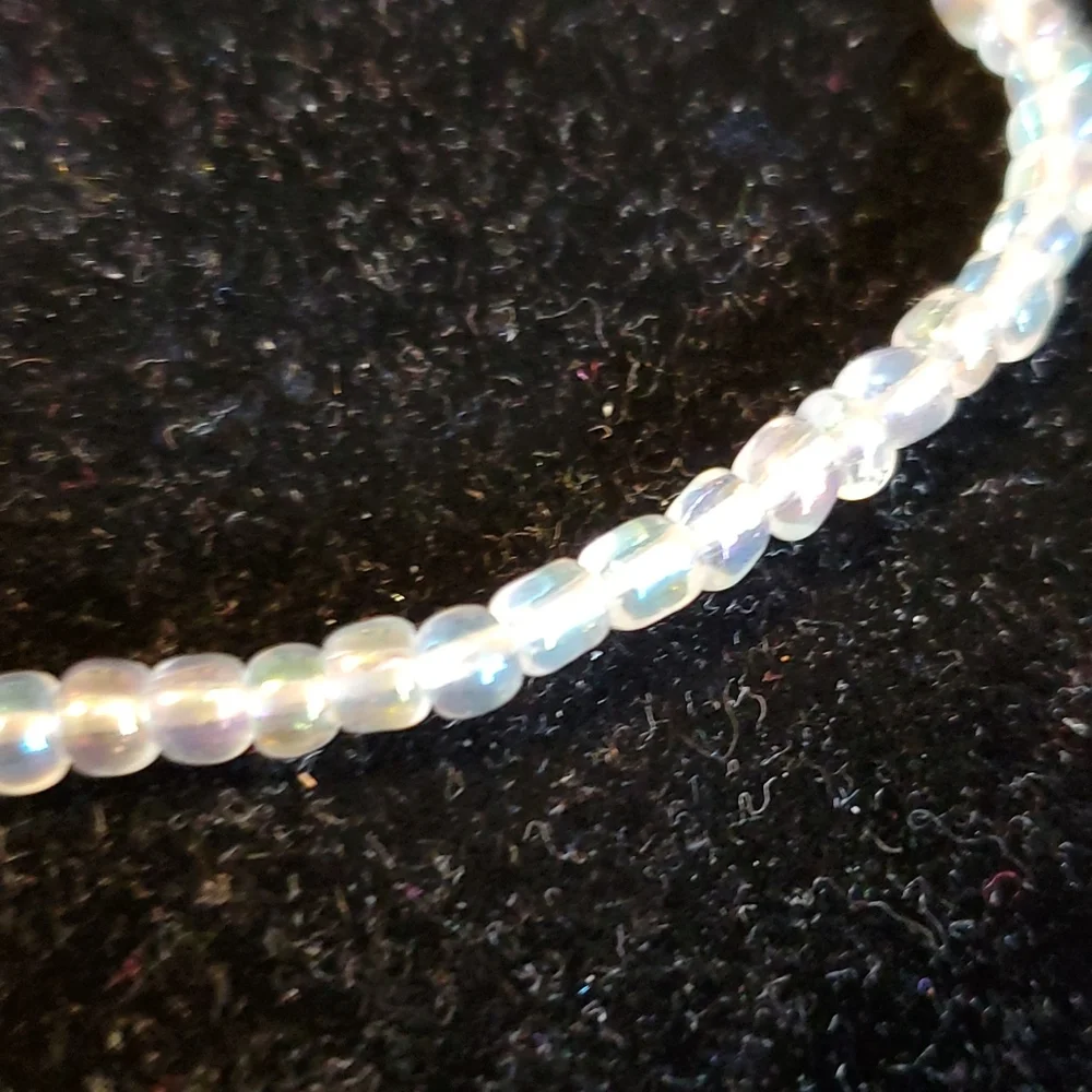 Clear iridescent beaded stretch necklace 14 inches long unstretched